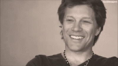 Black and White Photo of Man Smiling With Teeth