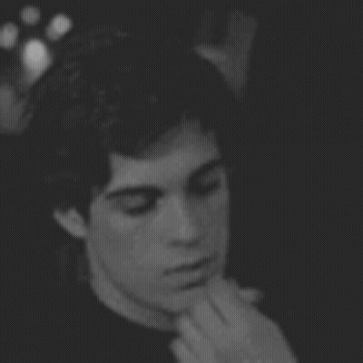 Black And White Photo Of Man Smoking Cigarette GIF
