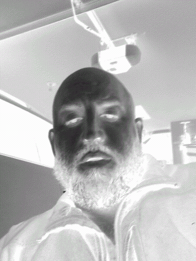Black And White Photo Of Man With Beard And Black Eyes GIF