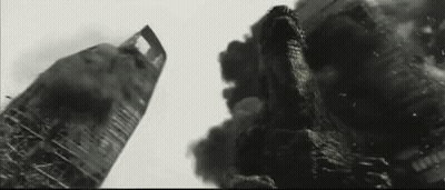 Black And White Photo Of Monster Destroying Building GIF