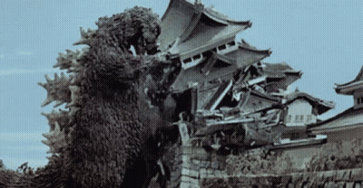 Black And White Photo Of Monster Destroying Castle GIF