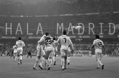 Black And White Photo Of People Holding Madrid Flags GIF