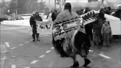 Black And White Photo Of People Holding Signs On Street GIF