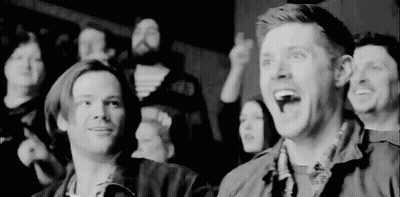 Black And White Photo Of People Sitting In Theater GIF
