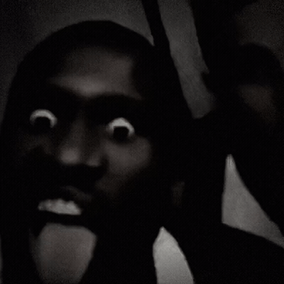 Black And White Photo Of Person Face Blurred Background GIF