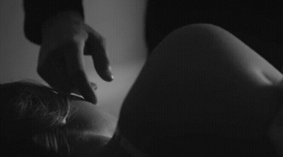 Black And White Photo Of Person Holding Leg GIF
