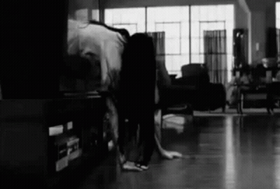 Black And White Photo Of Person In Living Room GIF