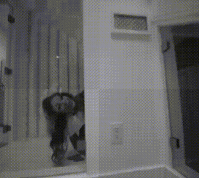 Black And White Photo Of Person Looking In Mirror GIF
