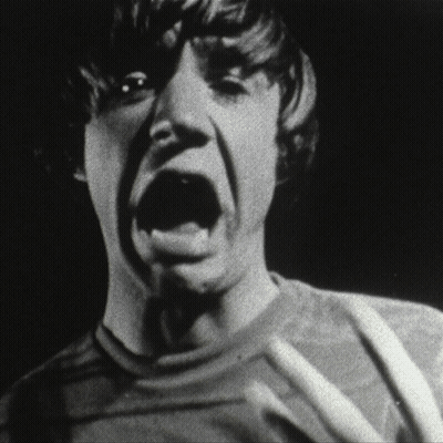 Black and White Photo of Person Mouth Wide Open