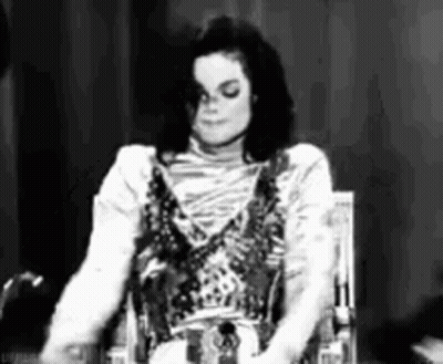 Black And White Photo Of Person Sitting In Chair GIF