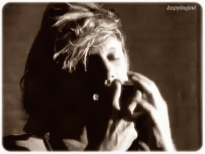 Black And White Photo Of Person Smoking Cigarette GIF
