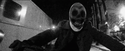 Black And White Photo Of Person Wearing Skull Mask GIF