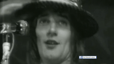 Black And White Photo Of Rod Stewart's Place With Person In Hat GIF