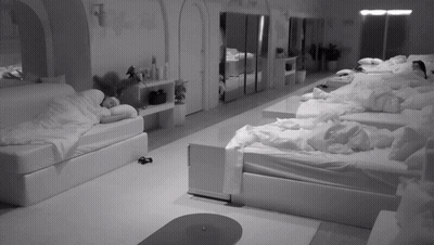 Black And White Photo Of Room Filled With Beds GIF