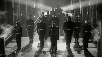Black And White Photo Of Soldiers Standing In Line GIF