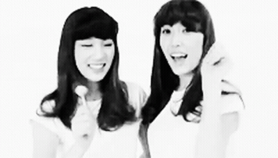 Black And White Photo Of Two Girls Standing Together GIF
