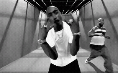 Black And White Photo Of Two Men In Hallway GIF