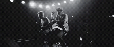 Black And White Photo Of Two Men Playing Guitars GIF