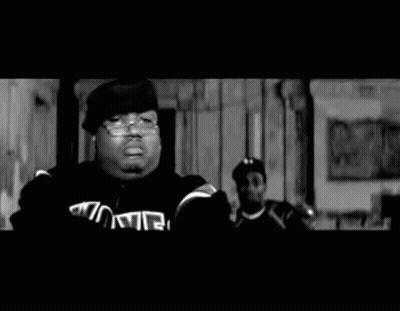 Black And White Photo Of Two Men Standing Together GIF