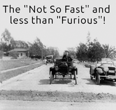 Black And White Photo Of Two Old Cars Saying The Not So Fast And Less Than Furious GIF