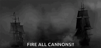 Black And White Photo Of Two Ships Firing Cannons GIF