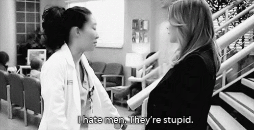 Black And White Photo Of Two Women In Hospital Lobby GIF