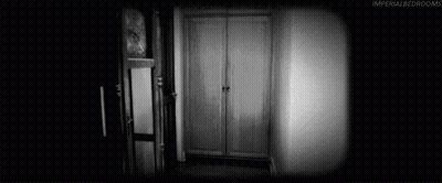 Black And White Photo Of Two Women Standing In Room GIF