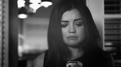 Black And White Photo Of Woman Crying At Cell Phone GIF