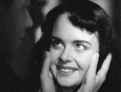 Black And White Photo Of Woman Holding Her Face GIF