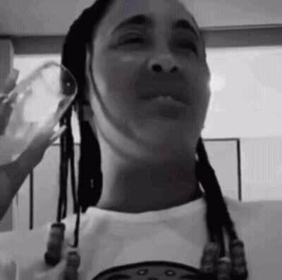 Black And White Photo Of Woman Holding Wine Glass GIF