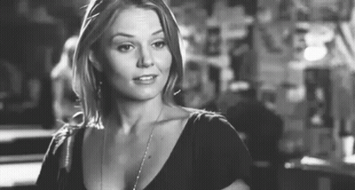 Black And White Photo Of Woman In Black Shirt And Necklace GIF