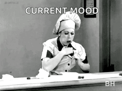 Black And White Photo Of Woman In Chef's Hat Eating Food GIF
