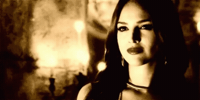 Black And White Photo Of Woman In Dark Room GIF