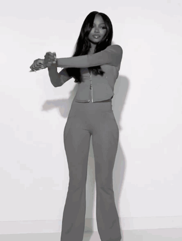 Black And White Photo Of Woman In Gray Outfit GIF