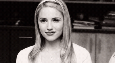 Black And White Photo Of Woman In Headband And White Shirt GIF