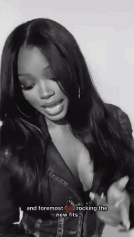 Black And White Photo Of Woman In Plunging Leather Jacket GIF