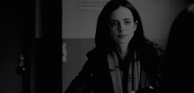 Black And White Photo Of Woman In Scarf And Jacket GIF