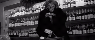 Black And White Photo Of Woman In Store GIF