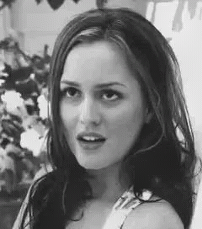 Black And White Photo Of Woman Looking At Camera GIF