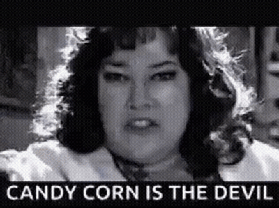 Black And White Photo Of Woman Saying Candy Corn Is The Devil GIF