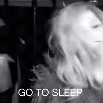 Black And White Photo Of Woman Saying Go To Sleep GIF