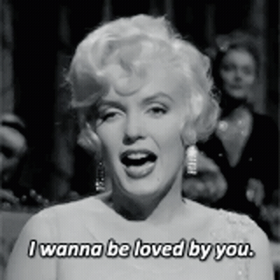 Black And White Photo Of Woman Saying I Wanna Be Loved By You GIF