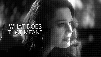 Black And White Photo Of Woman Saying What Does That Mean GIF