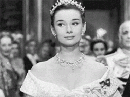 Black and White Photo of Woman Wearing Tiara and Necklace