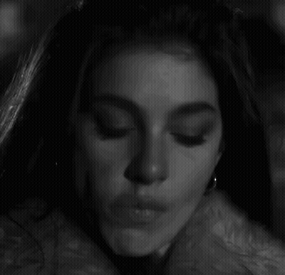 Black And White Photo Of Woman With Earrings And Nose Ring GIF