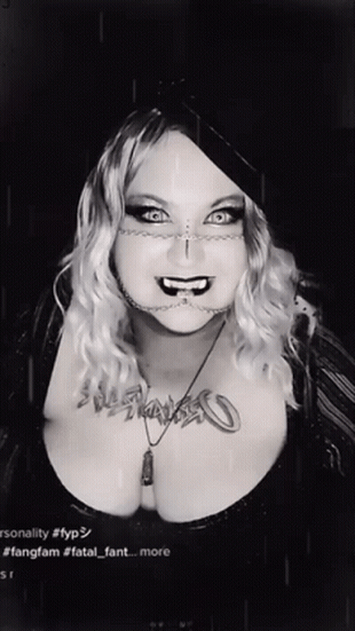 Black And White Photo Of Woman With Fatal Fant Necklace GIF