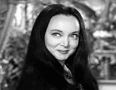 Black And White Photo Of Woman With Long Hair And Necklace GIF