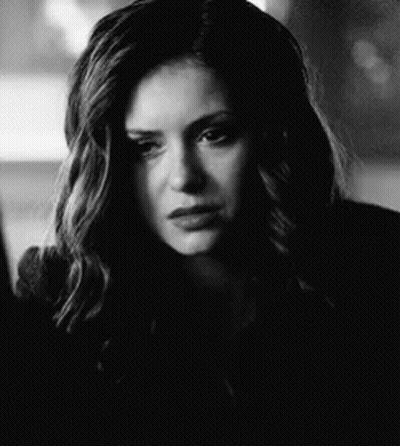 Black And White Photo Of Woman With Long Hair And Serious Look GIF