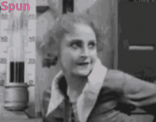 Black and White Photo of Woman With Spun in Pink