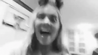 Black and White Photo of Woman With Tongue Out